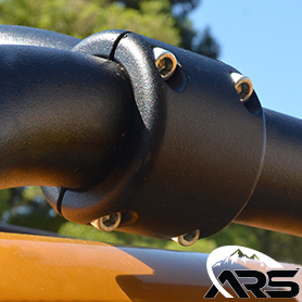CNC machined steel billet clamp with a black powdercoat finish wrapped around a roof rack bar on a orange Jeep