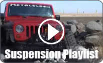 Suspension Playlist with red Jeep JK Wrangler with black MetalCloak fenders driving over boulders